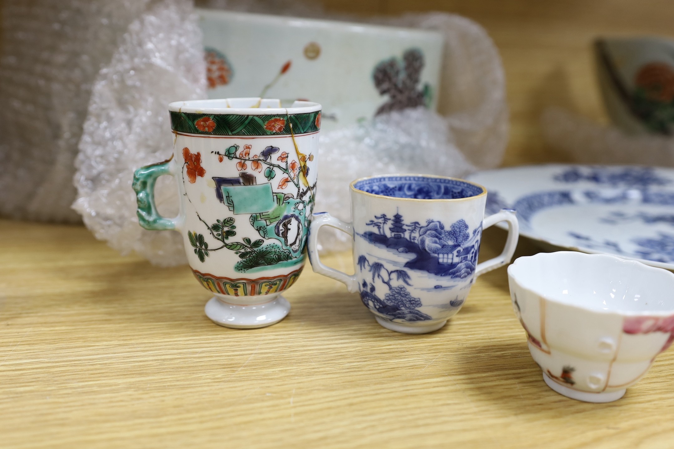 A pair of Chinese Kangxi famille verte cups, together with a large 18th century blue and white plate, and other mixed Chinese porcelain tea wares, including cups, and tea bowls